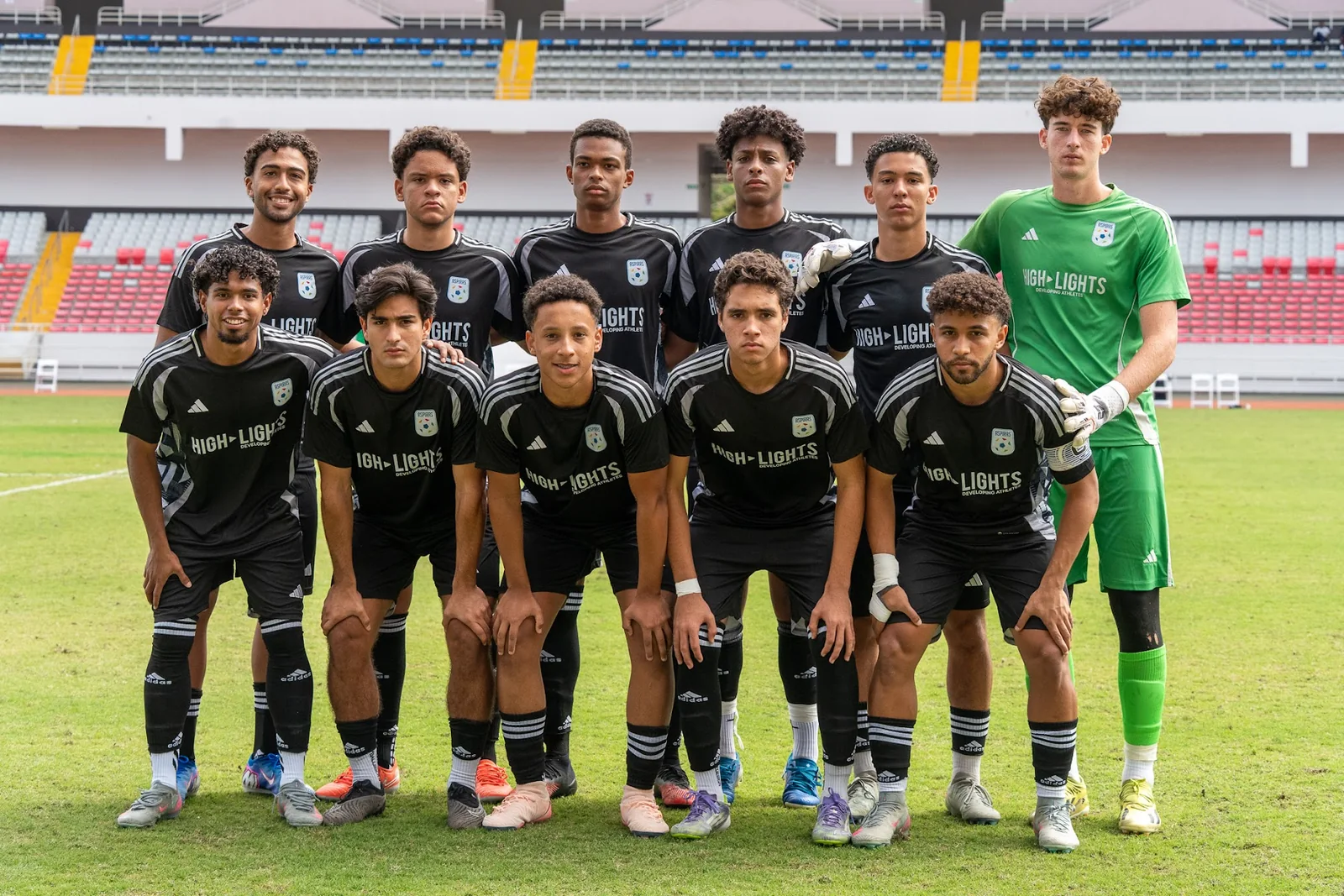 Highlights team posing together on a stadium field