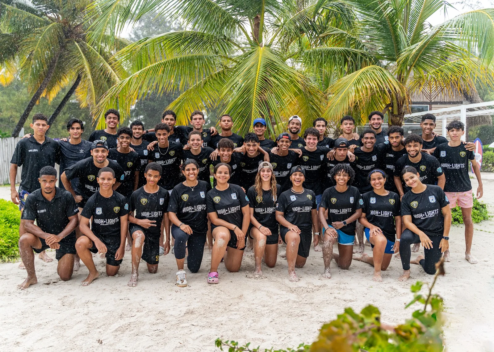 Large group of athletes gathered together after a learning experience